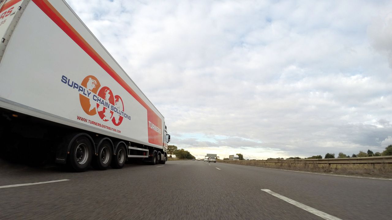 Mastering the First Impression: Your intriguing post title goes here A large semi truck labeled 'Supply Chain Solutions' travels down a highway under a cloudy sky.